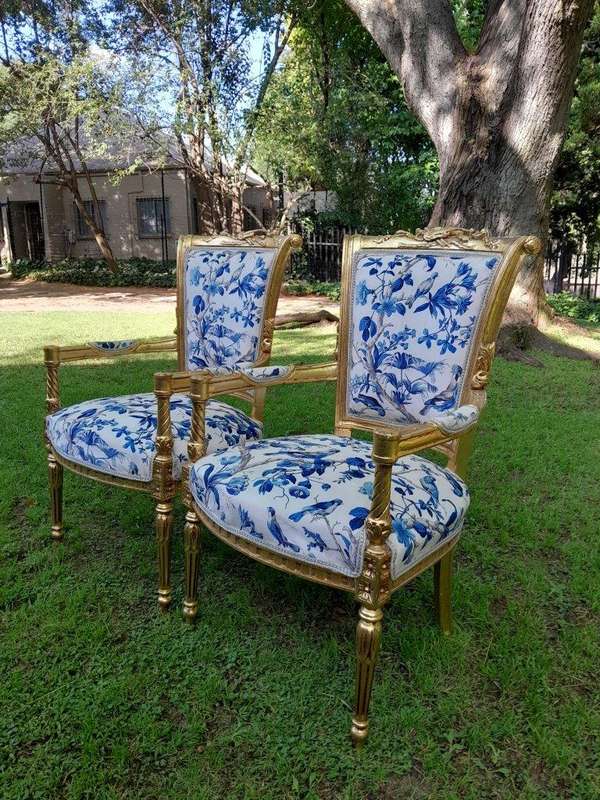 A Pair Of French Style Ornately Carved Wooden Armchairs