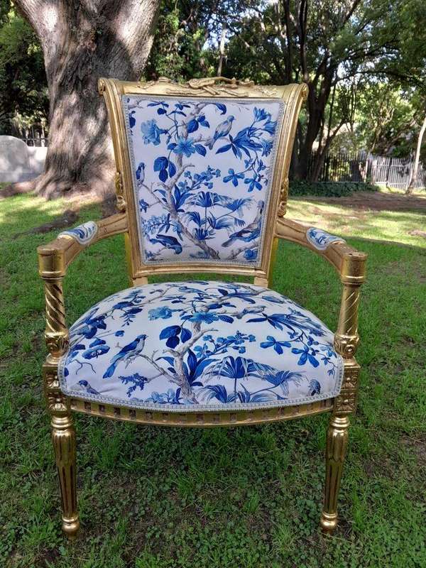 A Pair Of French Style Ornately Carved Wooden Armchairs