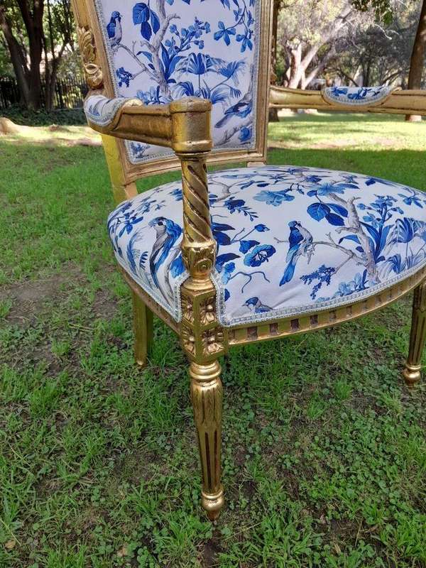 A Pair Of French Style Ornately Carved Wooden Armchairs