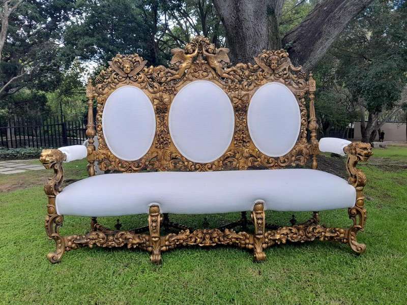 A 19th Century Ornately Carved Walnut Wood Settee Hand Gilded With Gold Leaf And Upholstered In A...