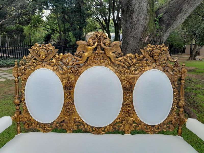 A 19th Century Ornately Carved Walnut Wood Settee Hand Gilded With Gold Leaf And Upholstered In A...
