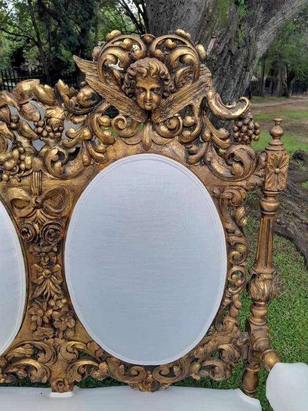 A 19th Century Ornately Carved Walnut Wood Settee Hand Gilded With Gold Leaf And Upholstered In A...