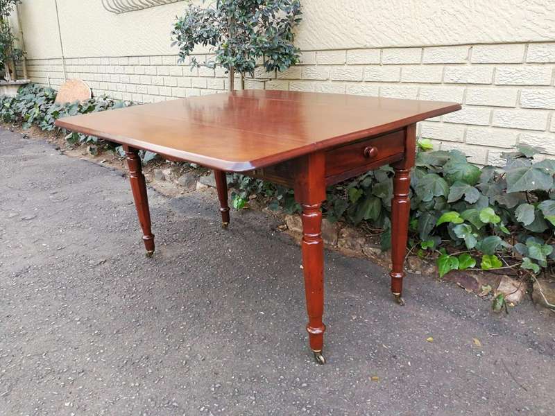 An Early 20th Century Mahogany Pembroke Table On Turned Legs