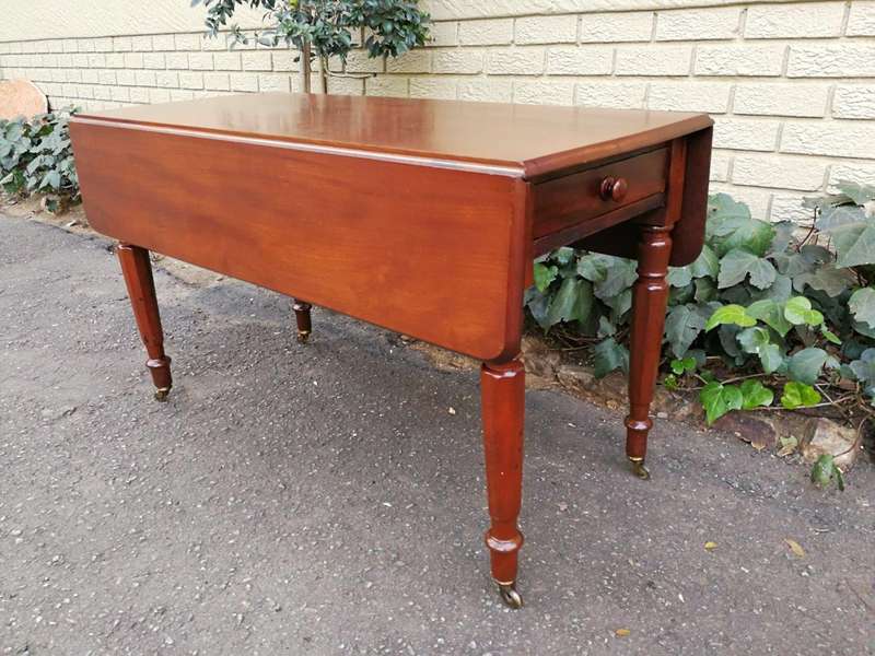 An Early 20th Century Mahogany Pembroke Table On Turned Legs