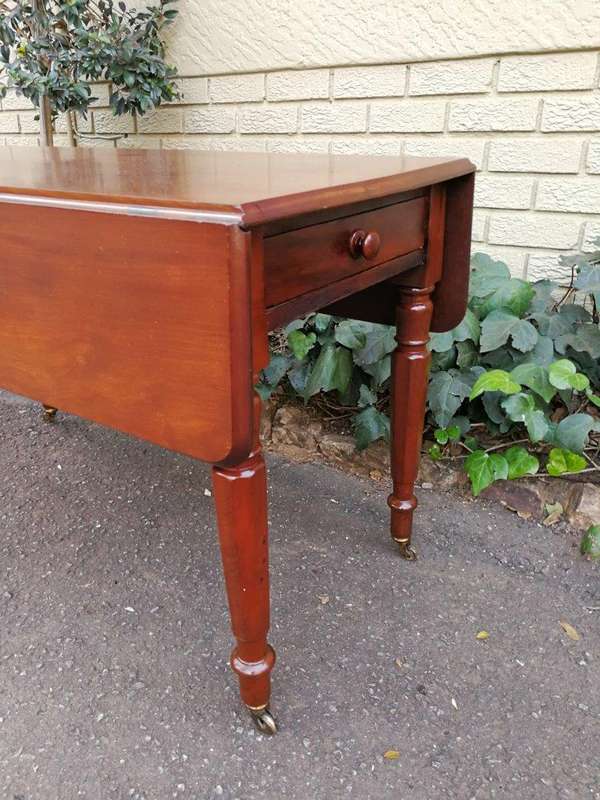 An Early 20th Century Mahogany Pembroke Table On Turned Legs