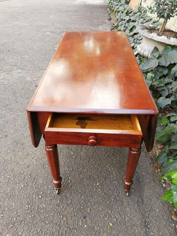 An Early 20th Century Mahogany Pembroke Table On Turned Legs