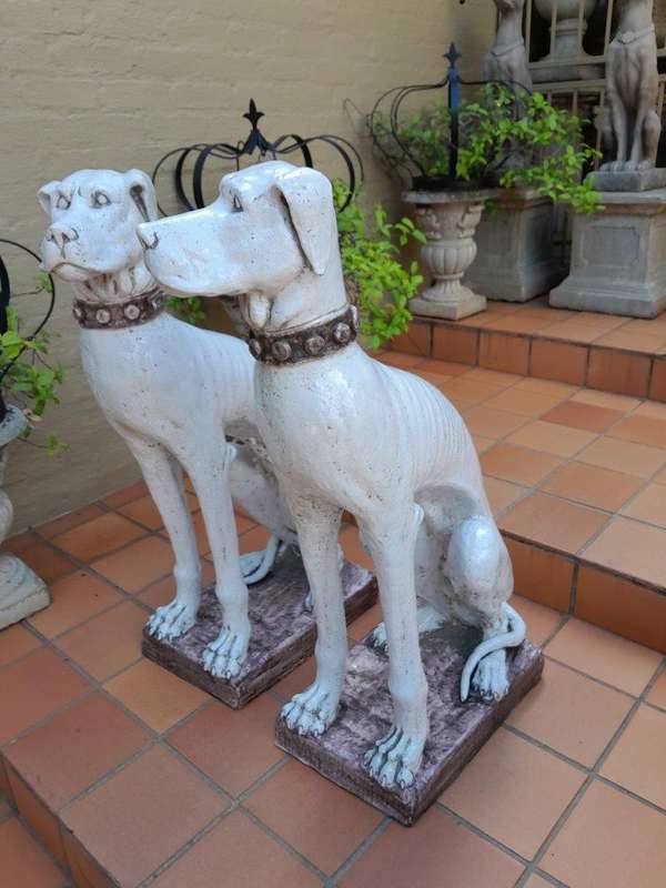 An Early 20th Century Pair Of Italian Porcelain Decorative Dogs On Clay Bases ND