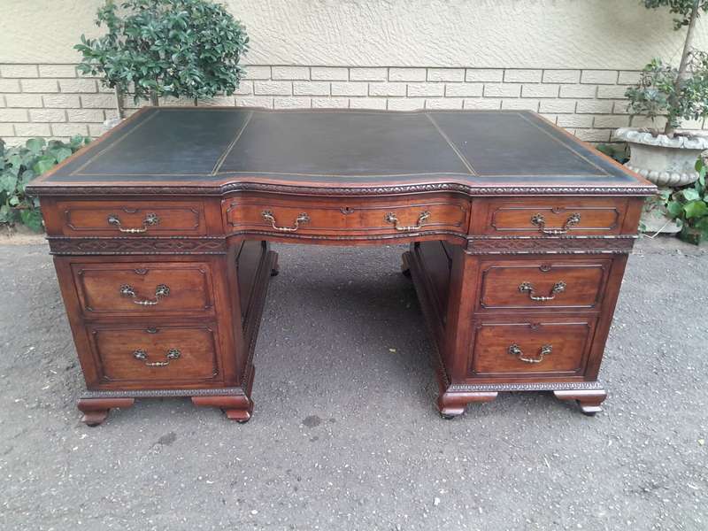 A 20th Century Large Mahogany Partners Pedestal Desk With Black Leather Top And Drawers On Bracke...