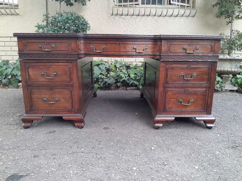 A 20th Century Large Mahogany Partners Pedestal Desk With Black Leather Top And Drawers On Bracke...