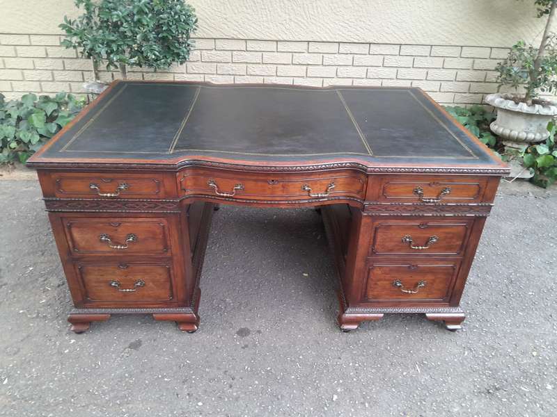 A 20th Century Large Mahogany Partners Pedestal Desk With Black Leather Top And Drawers On Bracke...