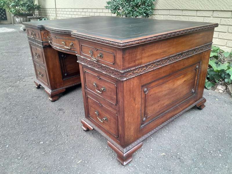 A 20th Century Large Mahogany Partners Pedestal Desk With Black Leather Top And Drawers On Bracke...