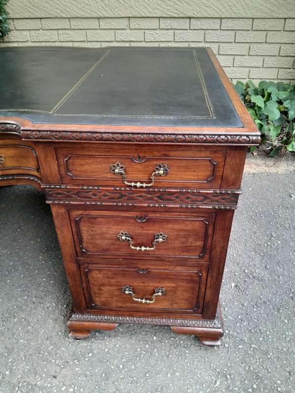 A 20th Century Large Mahogany Partners Pedestal Desk With Black Leather Top And Drawers On Bracke...