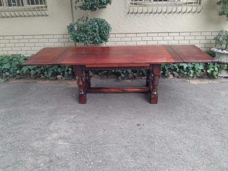 An Antique 19th Century Oak Refectory Table On Stretcher Base With Two Drawer Leaves