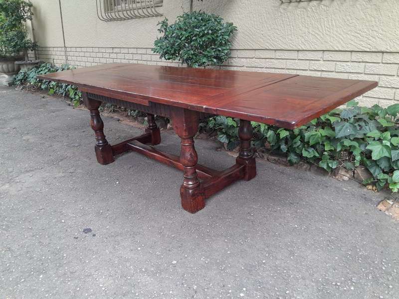 An Antique 19th Century Oak Refectory Table On Stretcher Base With Two Drawer Leaves