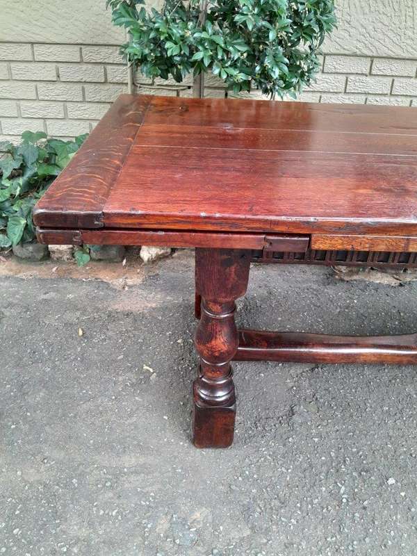 An Antique 19th Century Oak Refectory Table On Stretcher Base With Two Drawer Leaves
