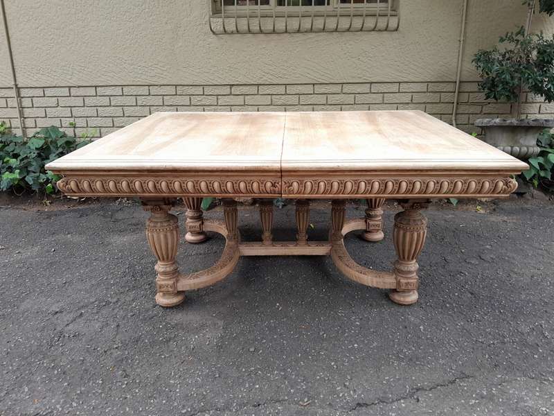 A 20th Century Heavily Carved Mahogany Dining  / Entrance Table In A Bleached Contemporary Finish