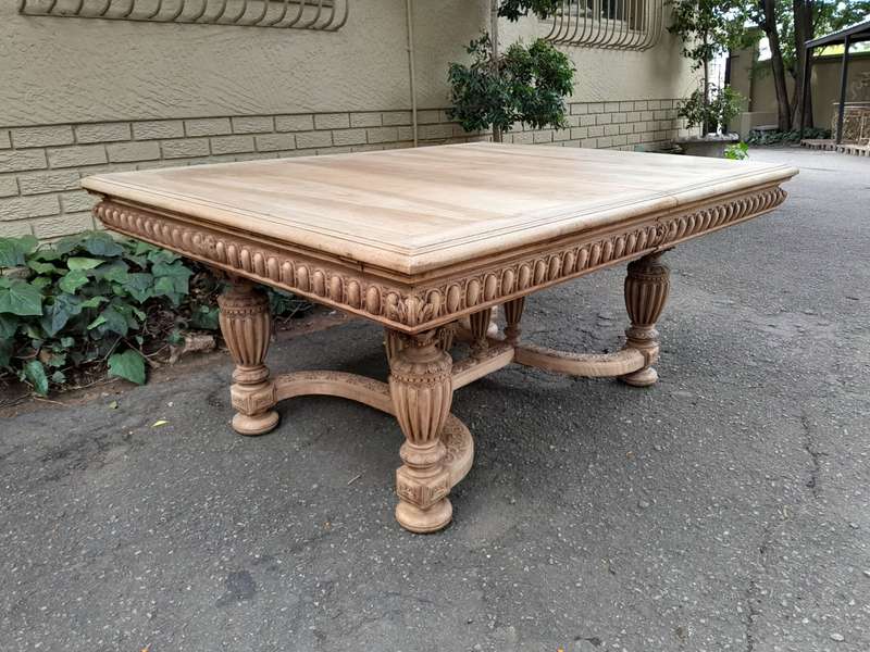 A 20th Century Heavily Carved Mahogany Dining  / Entrance Table In A Bleached Contemporary Finish