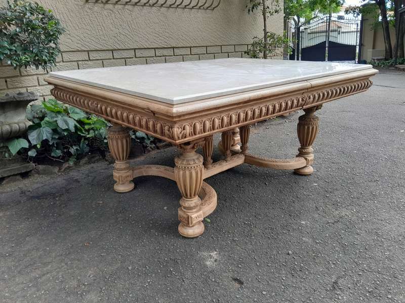 A 20th Century Heavily Carved Mahogany Dining  / Entrance Table In A Bleached Contemporary Finish