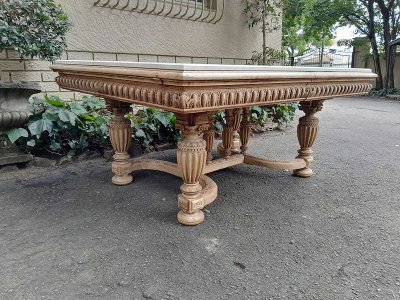 A 20th Century Heavily Carved Mahogany Dining  / Entrance Table In A Bleached Contemporary Finish