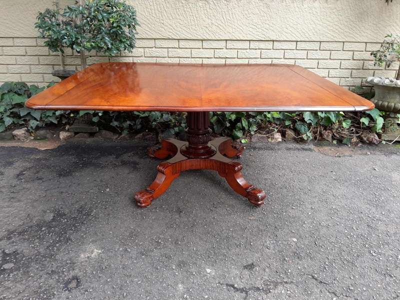An Antique William IV Breakfast Table With Hinged Top On Castors