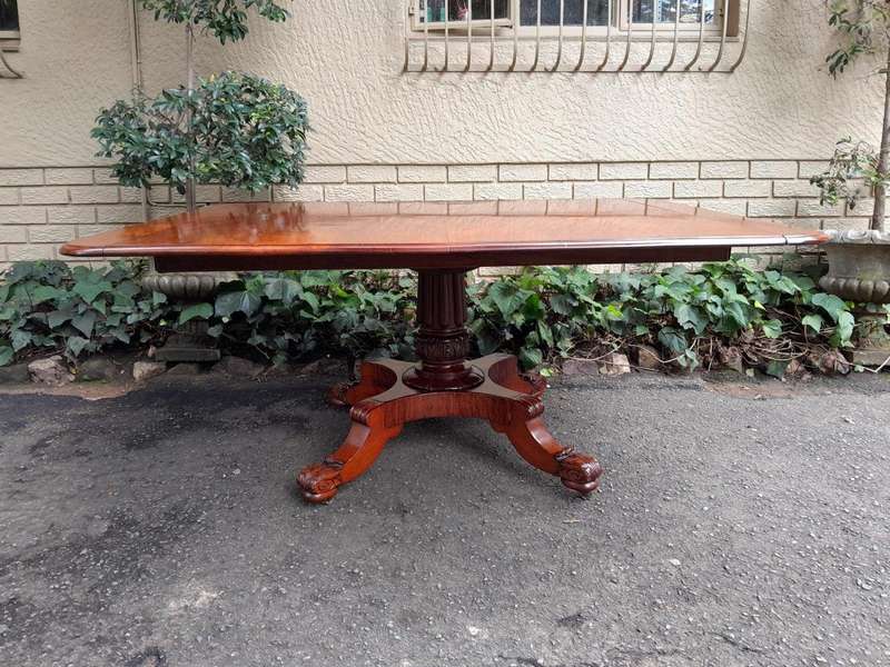 An Antique William IV Breakfast Table With Hinged Top On Castors