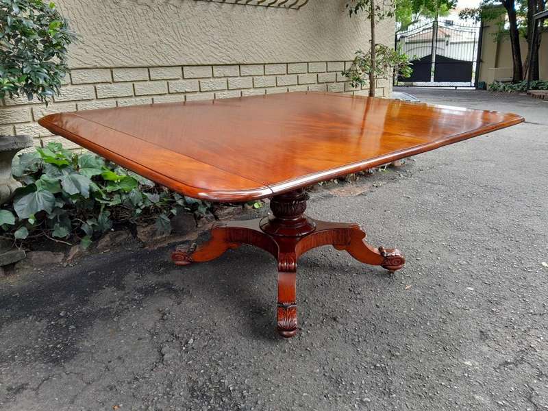 An Antique William IV Breakfast Table With Hinged Top On Castors