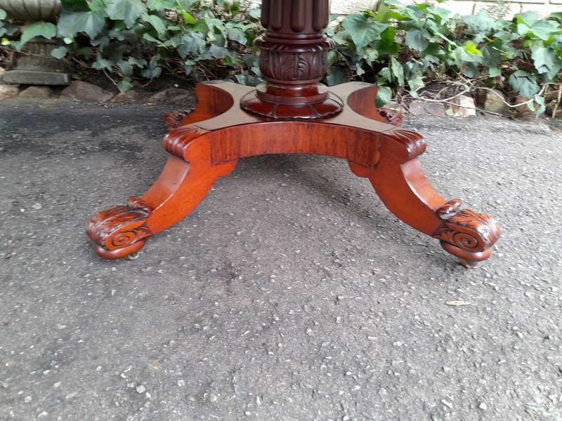 An Antique William IV Breakfast Table With Hinged Top On Castors
