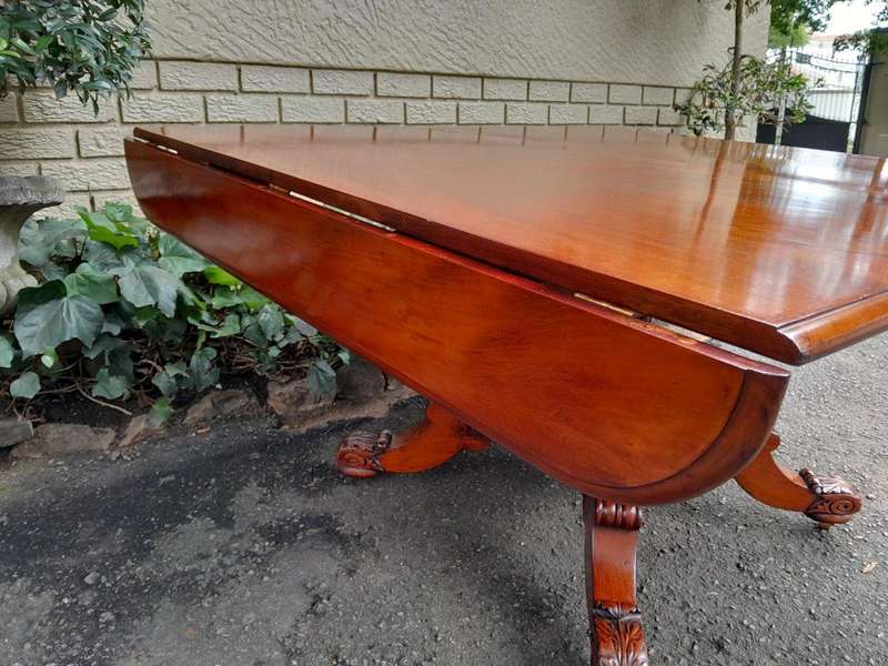 An Antique William IV Breakfast Table With Hinged Top On Castors