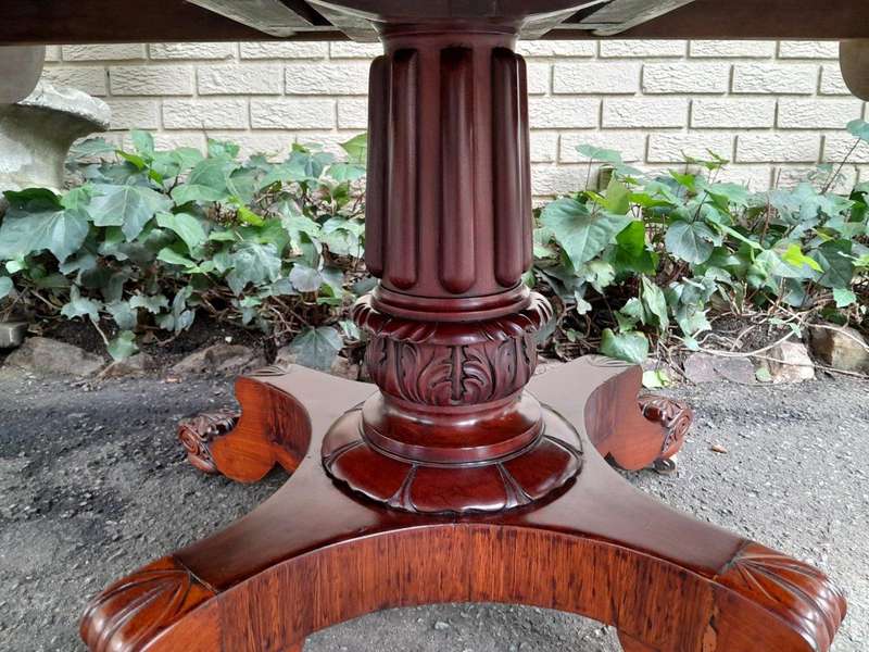 An Antique William IV Breakfast Table With Hinged Top On Castors