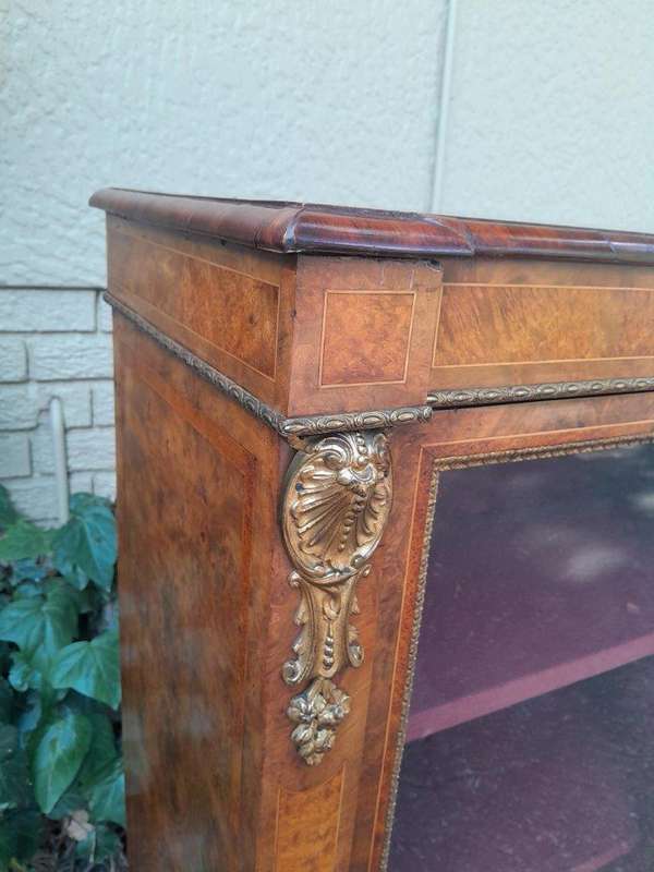 A Victorian Walnut Credenza / Display Cabinet With Gilt Mounts And Glazed Doors With Shelves On B...