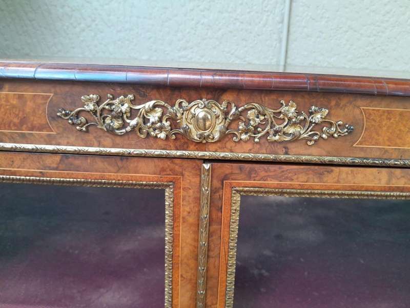 A Victorian Walnut Credenza / Display Cabinet With Gilt Mounts And Glazed Doors With Shelves On B...