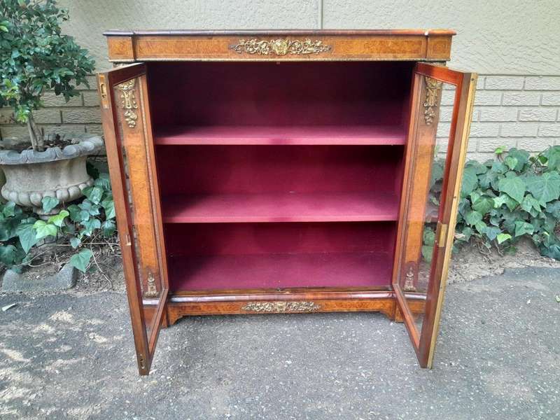 A Victorian Walnut Credenza / Display Cabinet With Gilt Mounts And Glazed Doors With Shelves On B...