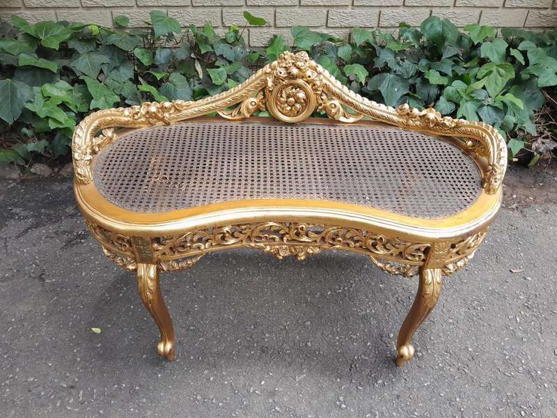 A 20th Century French Ornately Carved Giltwood And Rattan Window Seat