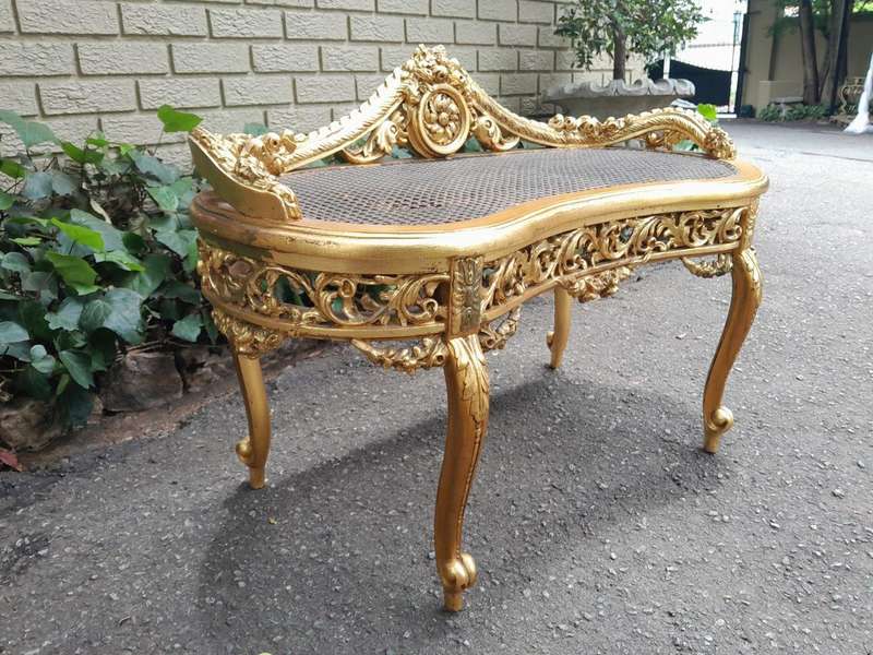 A 20th Century French Ornately Carved Giltwood And Rattan Window Seat