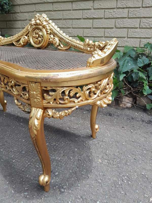 A 20th Century French Ornately Carved Giltwood And Rattan Window Seat