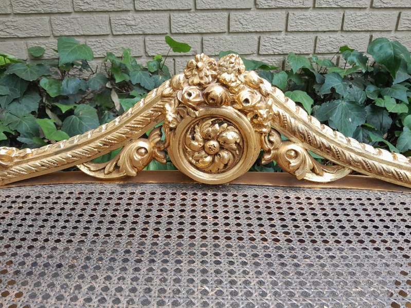 A 20th Century French Ornately Carved Giltwood And Rattan Window Seat