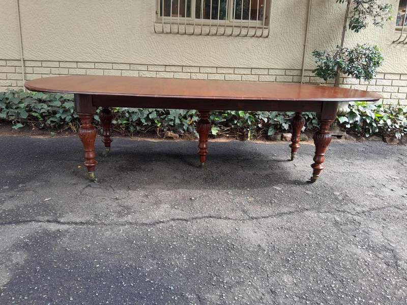 A 20th Century French Colonial Table on Original Brass Castors