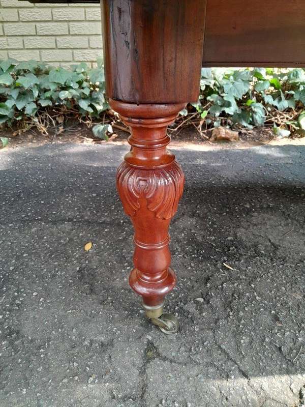 A 20th Century French Colonial Table on Original Brass Castors