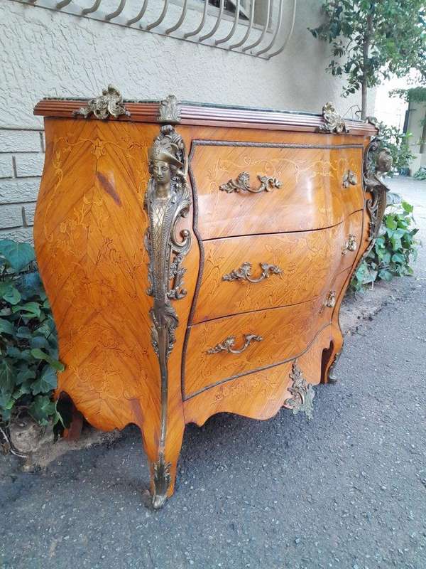 A 20th Century French Style Bombe Chest Of Drawers With Marble Top And Gilt Mounts