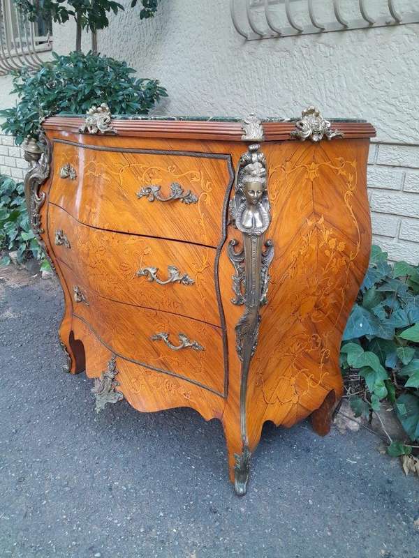 A 20th Century French Style Bombe Chest Of Drawers With Marble Top And Gilt Mounts