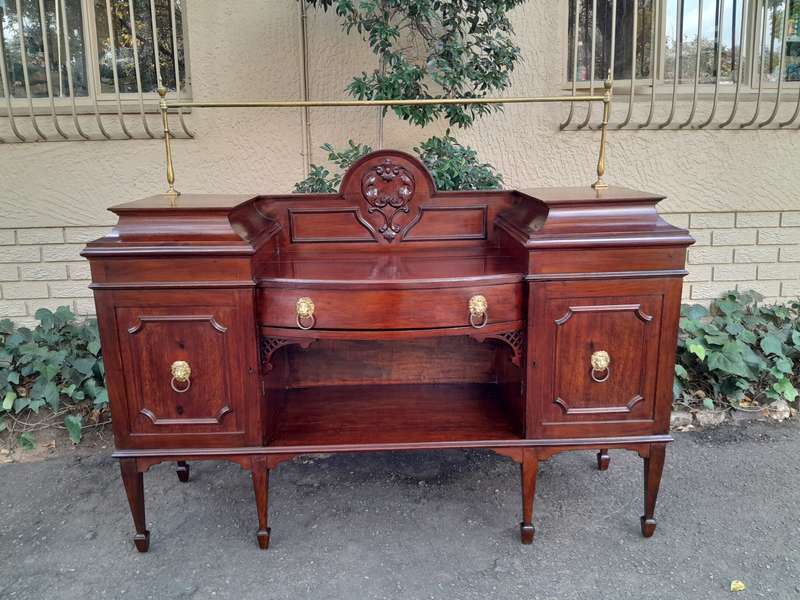 A 19th Century Mahogany Sideboard with Brass Gallery Rail and Brass Handles