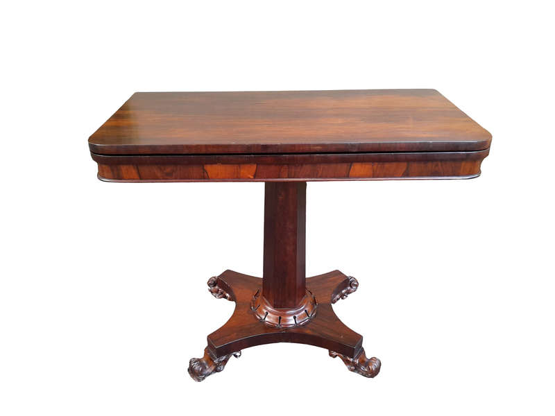 A Victorian rosewood swivel and tilt Card Table, on spreading hexagonal column to the concave pla...