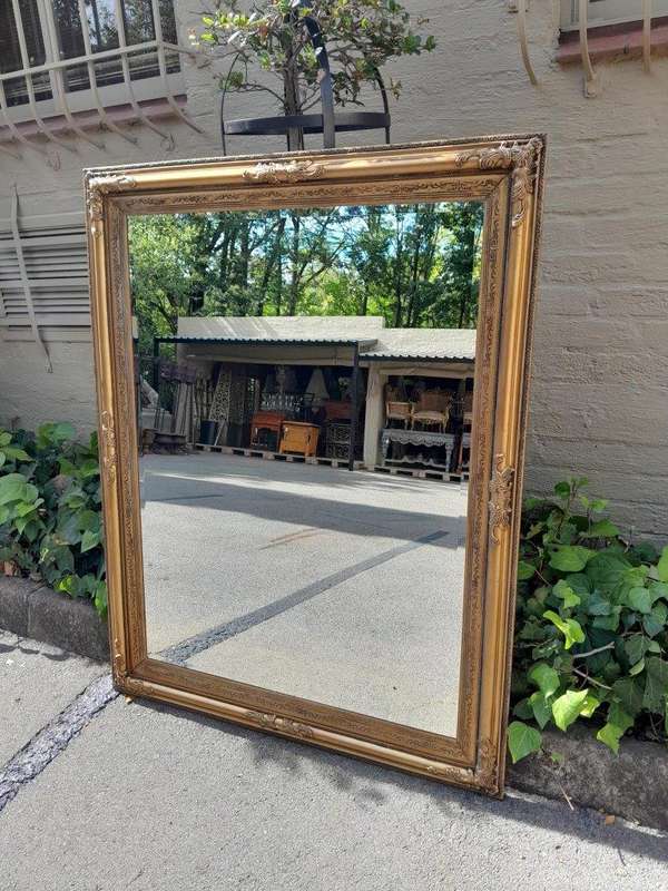 A Carved Gilt Wood Bevelled Mirror
