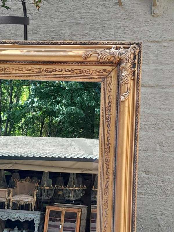 A Carved Gilt Wood Bevelled Mirror
