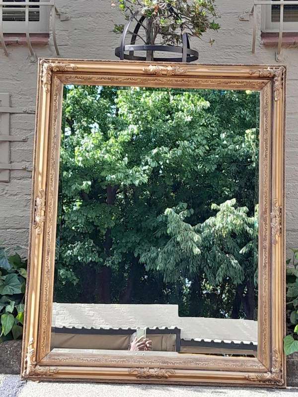 A Carved Gilt Wood Bevelled Mirror