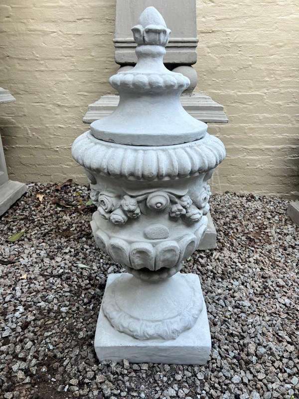 A Pair Of French Style Urns  With Lids Finished In A Concrete Patina Colour
