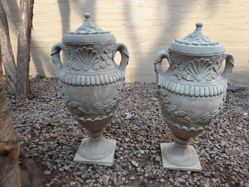 A Pair of Urns with Handles and Lids Finished in a Concrete Patina Colour