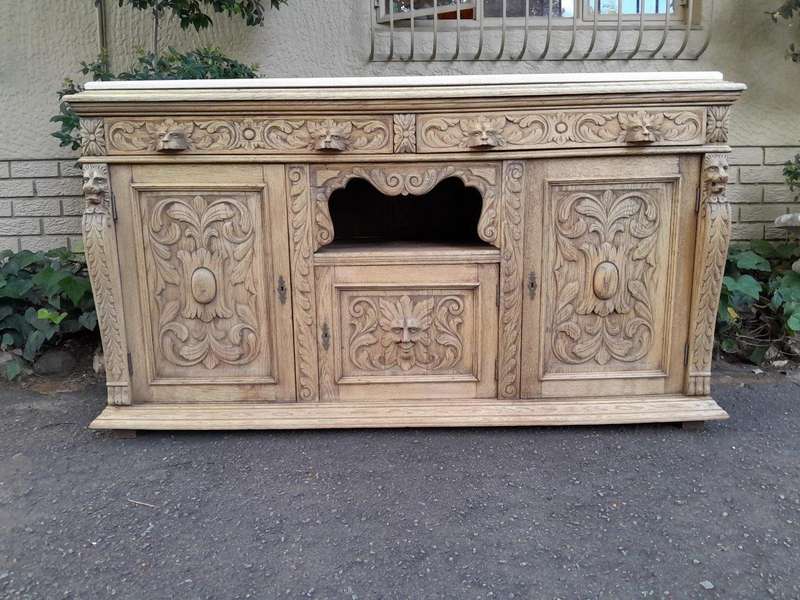 An Early 20th Century Heavily Carved Oak Sideboard / Buffet / Drinks Table With Two Drawers And T...