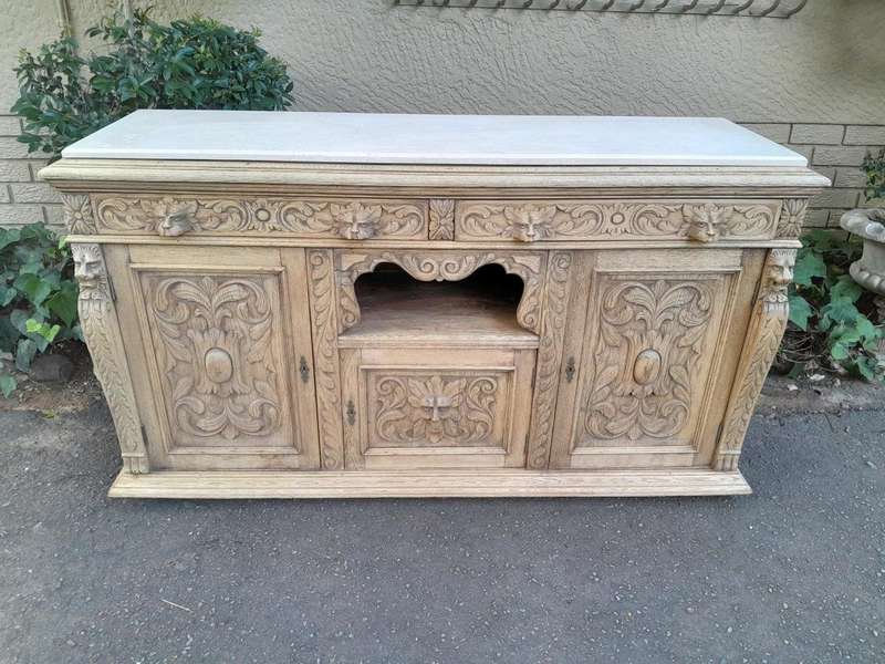 An Early 20th Century Heavily Carved Oak Sideboard / Buffet / Drinks Table With Two Drawers And T...