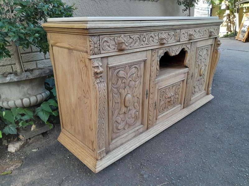 An Early 20th Century Heavily Carved Oak Sideboard / Buffet / Drinks Table With Two Drawers And T...